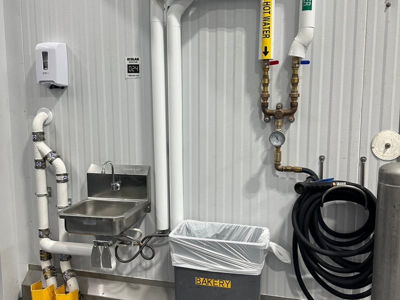 Commercial hand sink with new PVC drain and supply piping